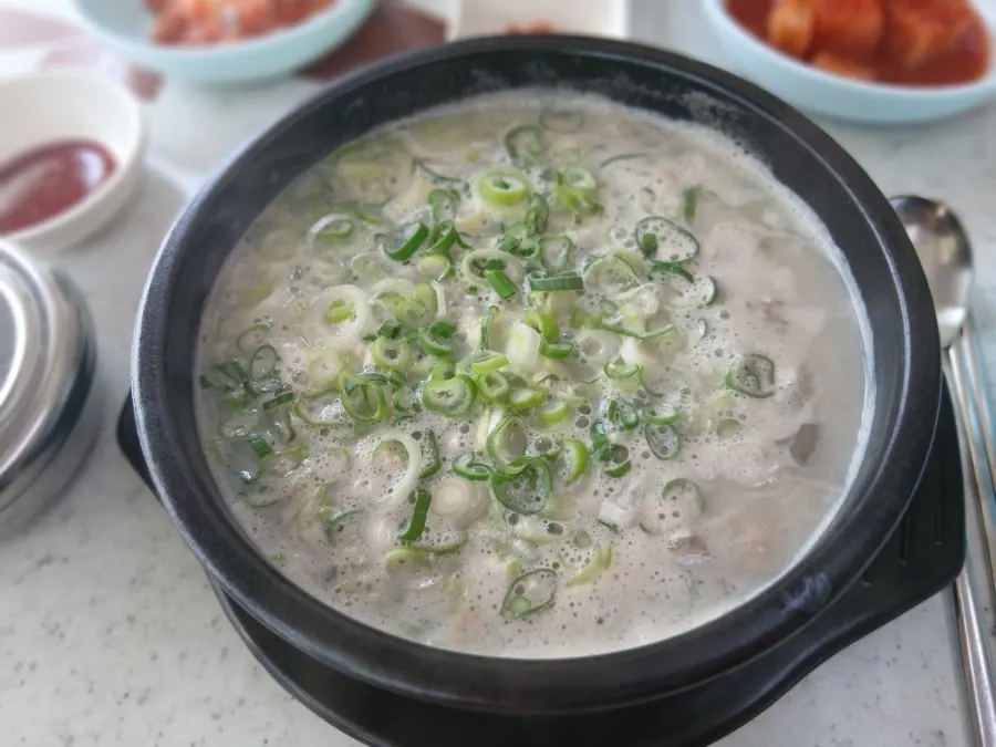 Table setting with gukbap and side dishes