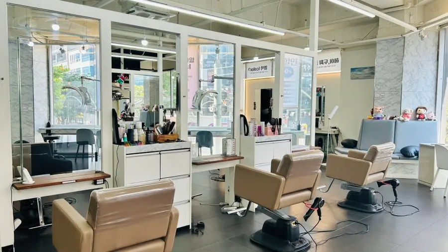 Spacious salon interior with white-toned decor