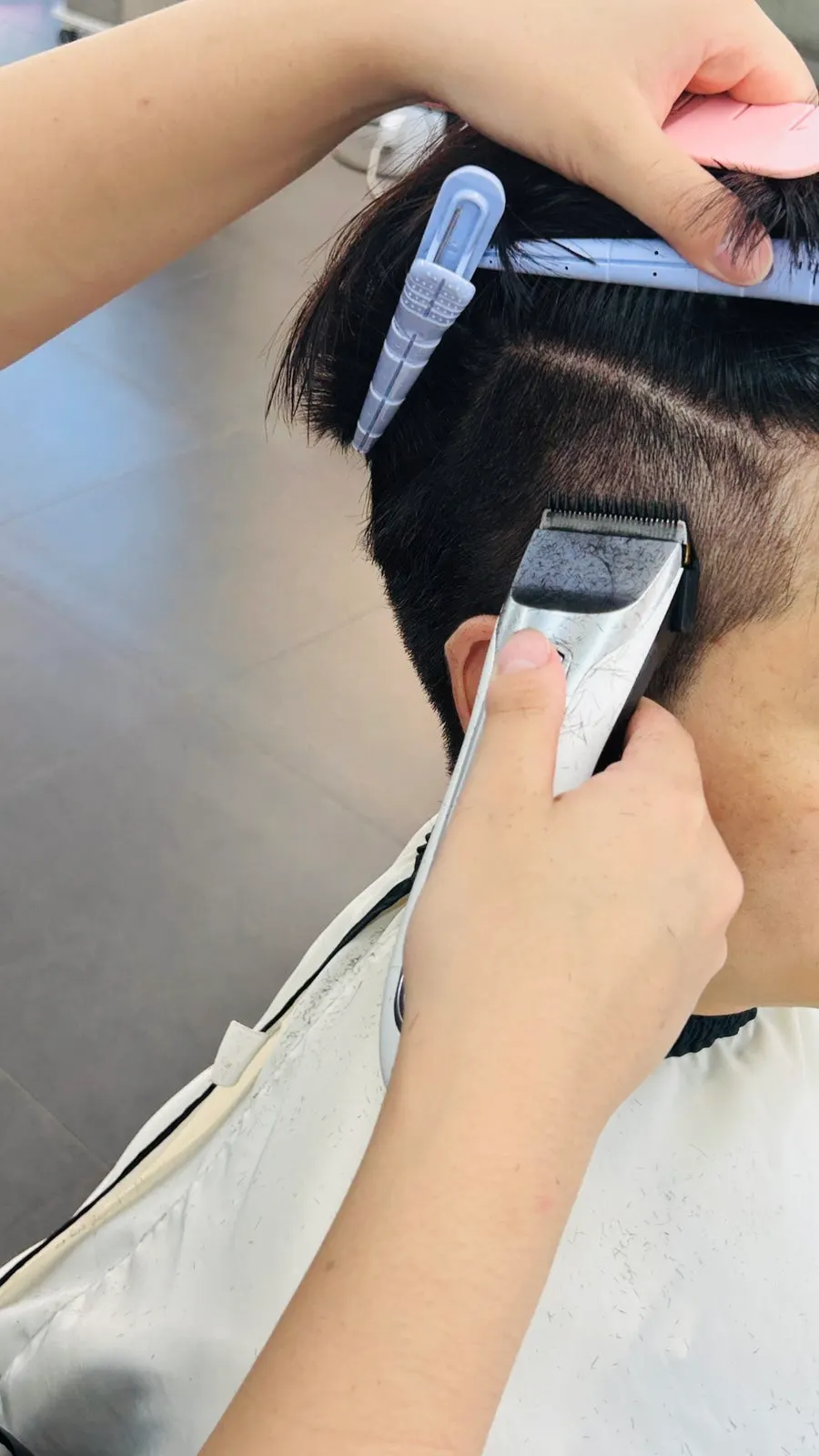 Receiving a scalp massage in the shampoo room