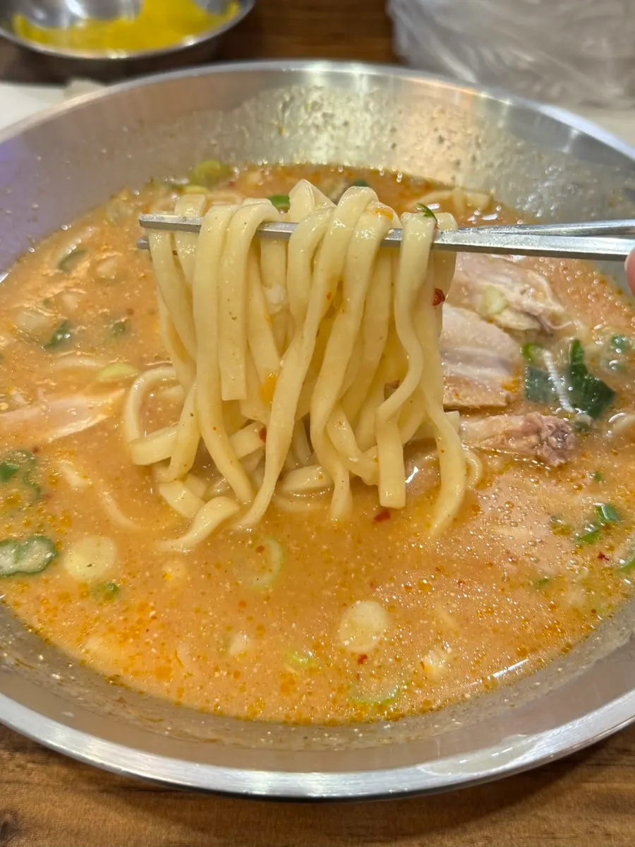 Spicy chicken kalguksu with savory seasoning