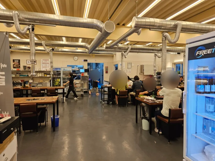 Spacious interior of Hoseongjeong Butcher's Restaurant with many tables