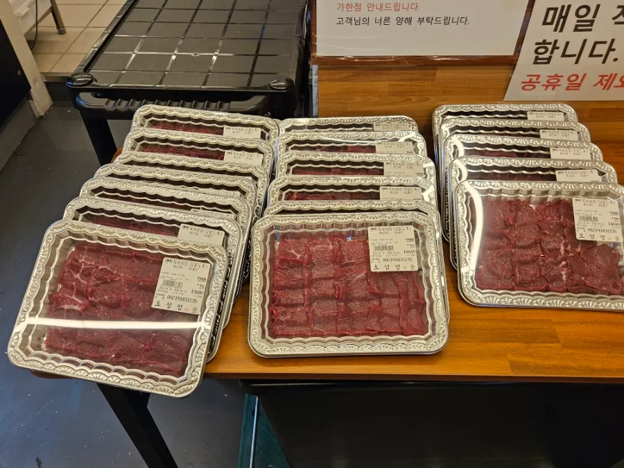 Korean beef and pork displayed in the meat showcase