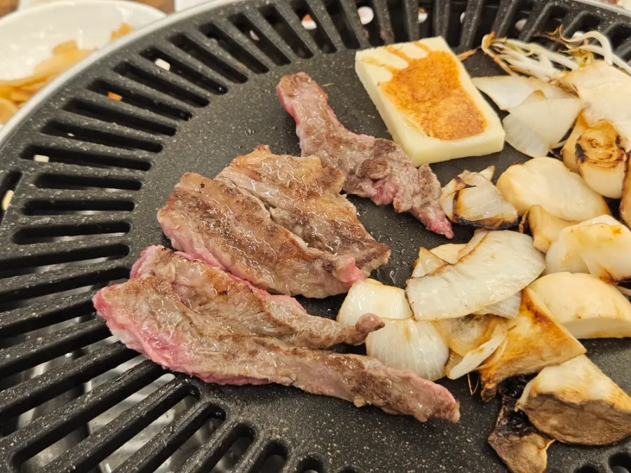 Korean beef galbisal cooking on the grill