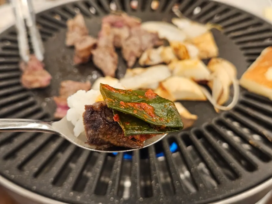 A plate of beef paired with side dishes