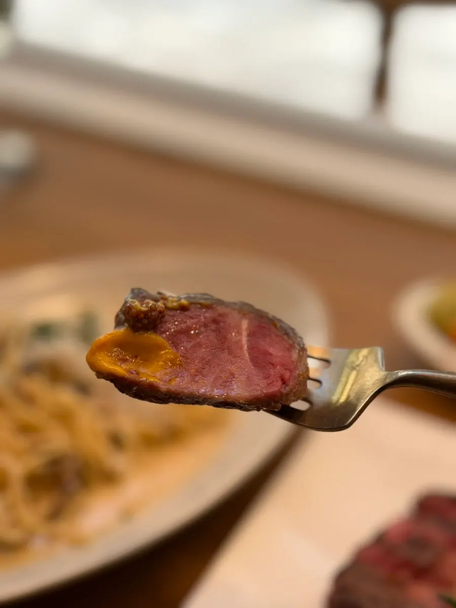 Steak topped with sweet pumpkin puree and whole grain mustard
