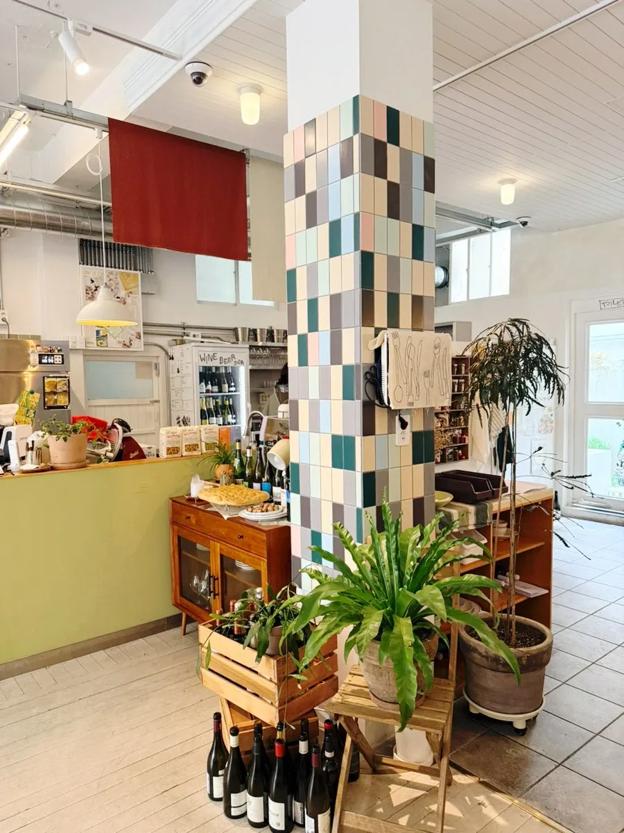 Interior with wooden furniture and plants