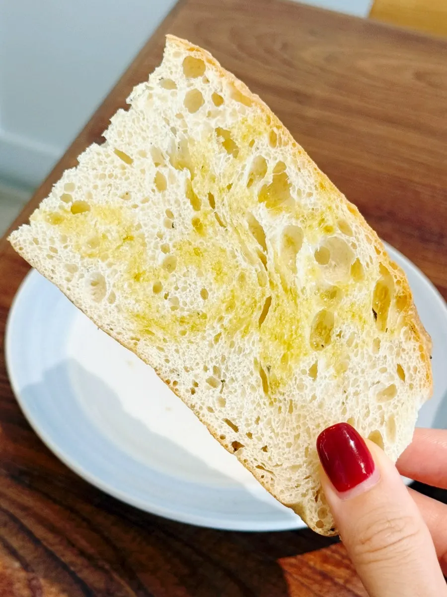 Focaccia dipped in tomato stew sauce