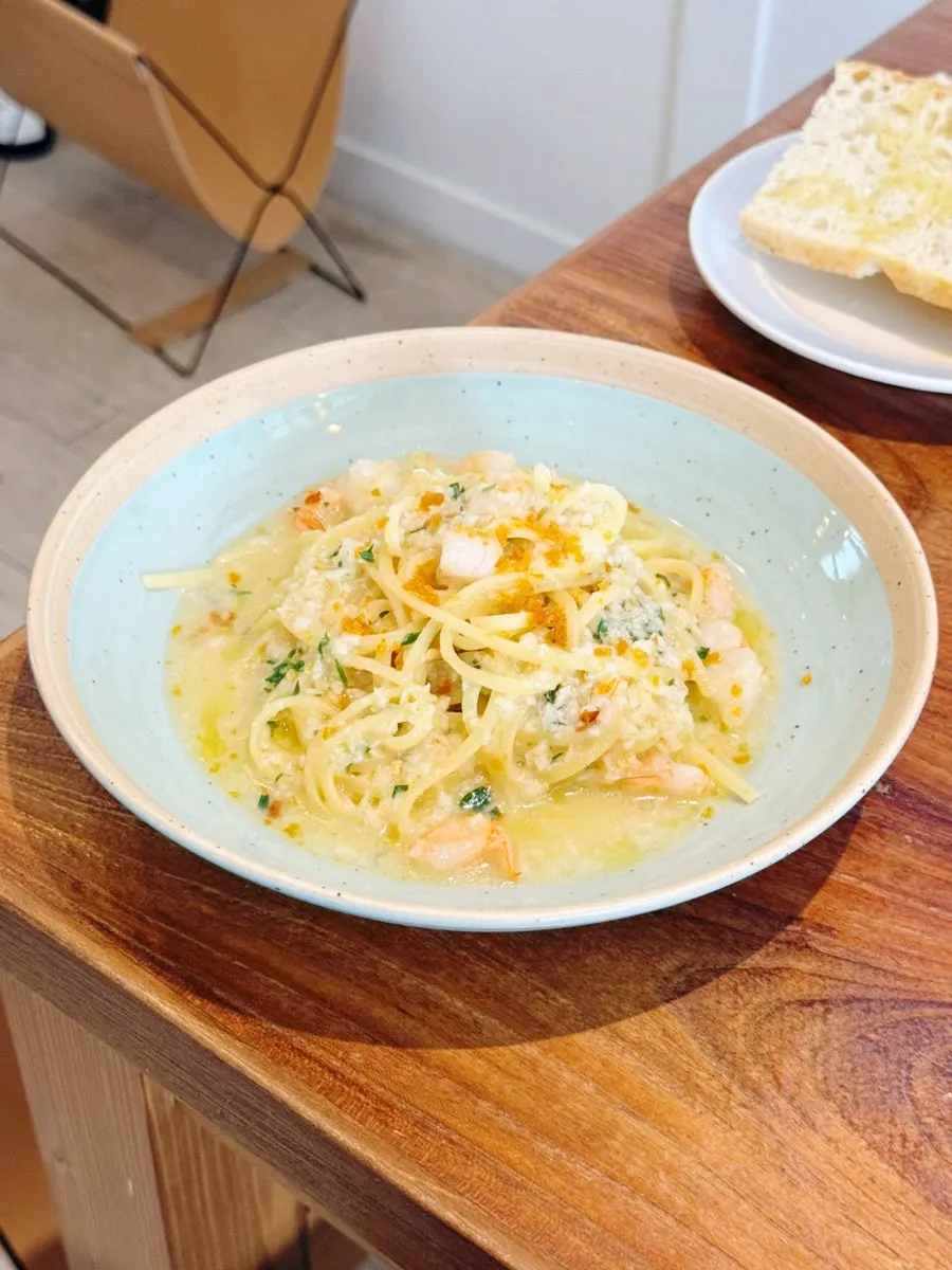 Tomato stew and bottarga pasta table setting