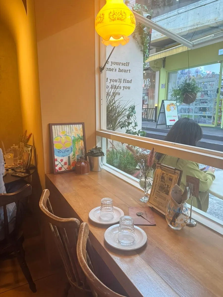 An envelope prop placed at the window seat