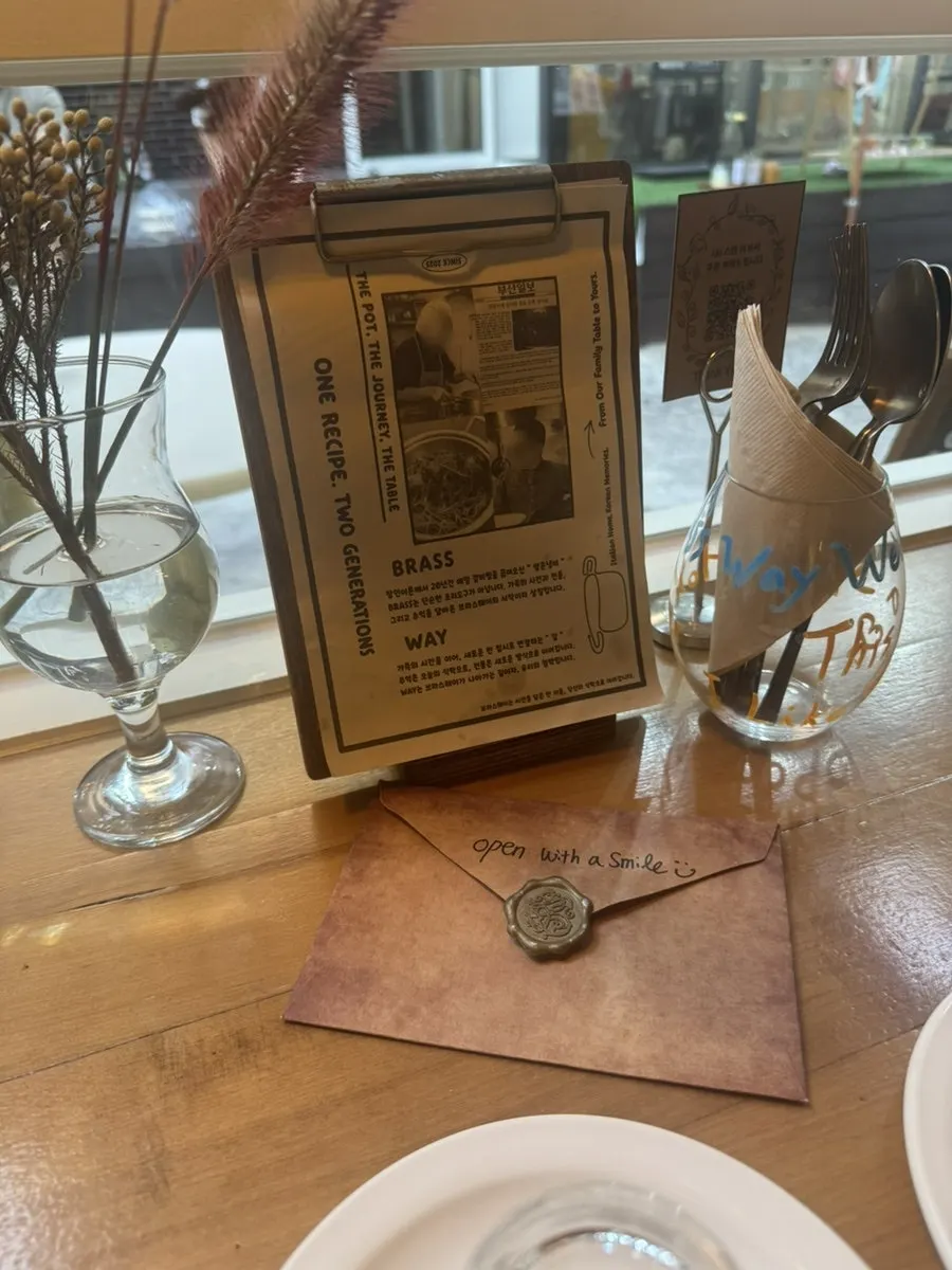 Envelope and props on a Brassway table