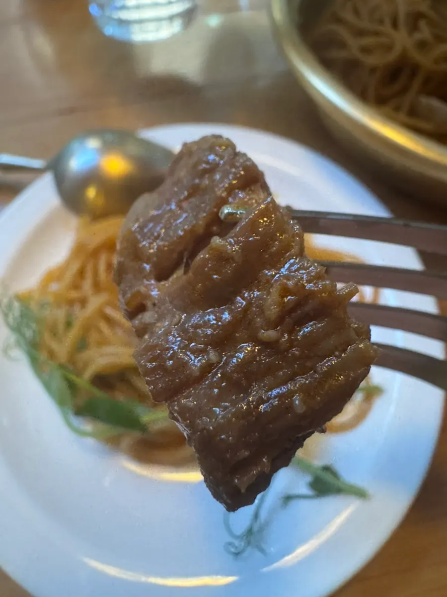 Tender galbi meat piled generously on the pasta