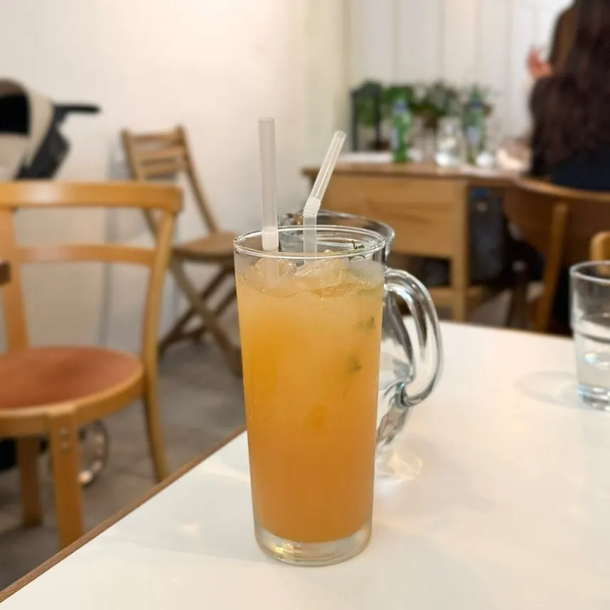 A glass of apple juice at Odd Bird Oliver