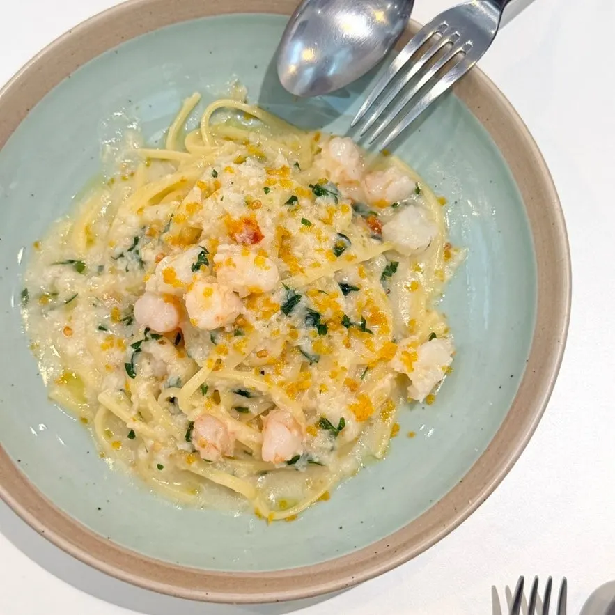 Close-up of aglio olio topped with bottarga