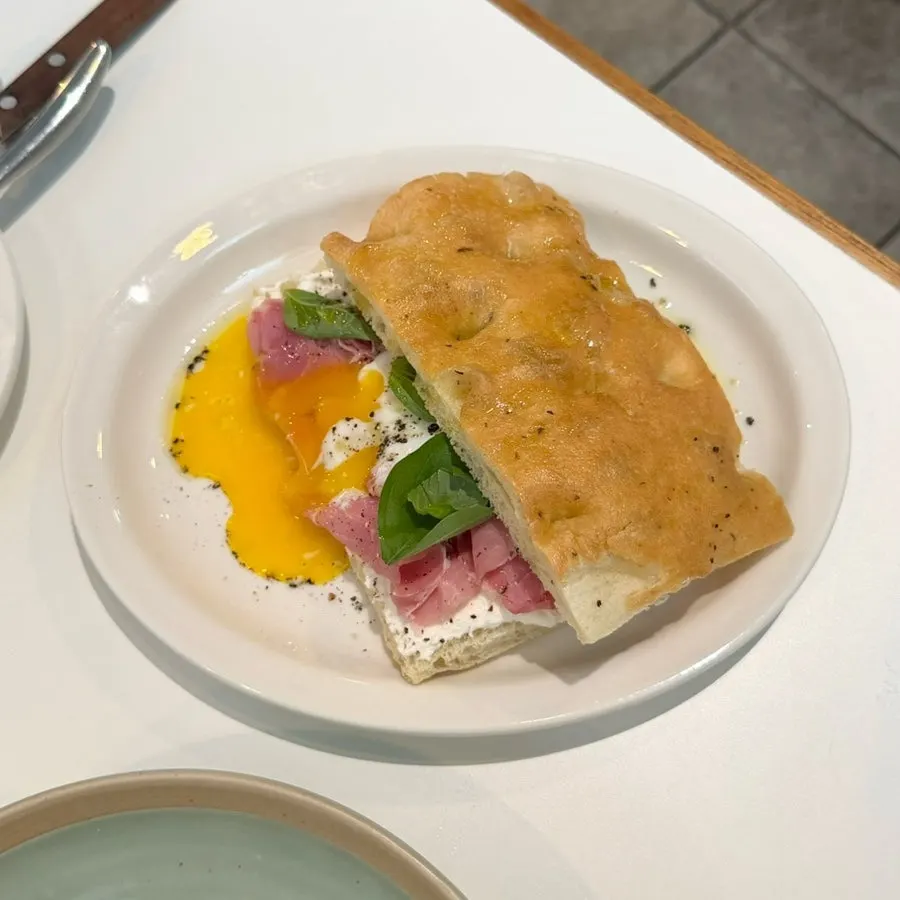Focaccia topped with house-made jambon and poached egg