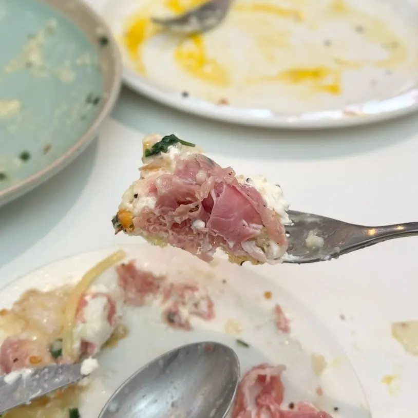 Sandwich stacked with moist poached egg and jambon