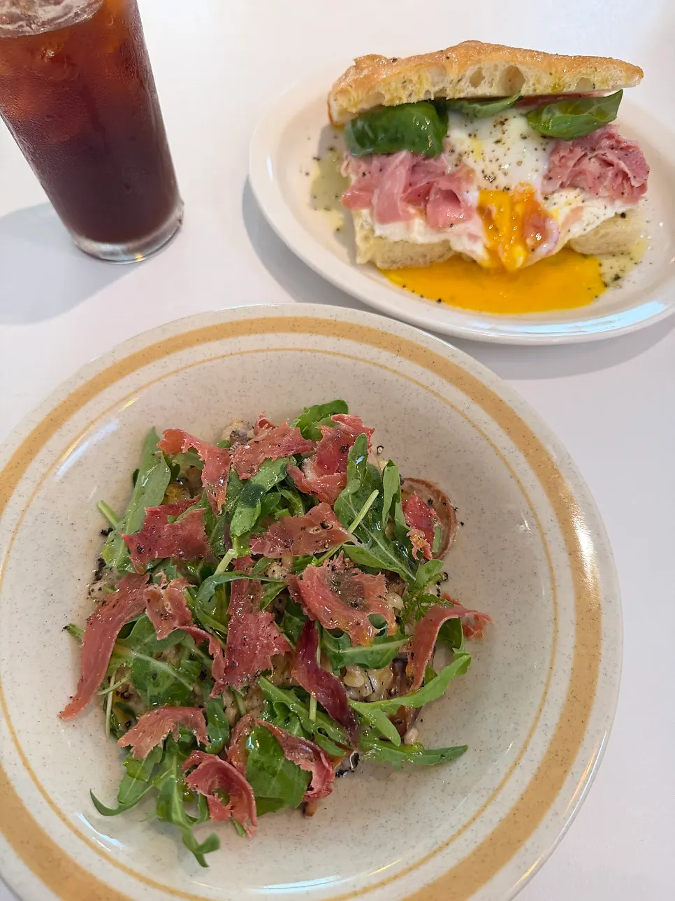 Hamon mushroom risotto and Bismarck sandwich served on the table