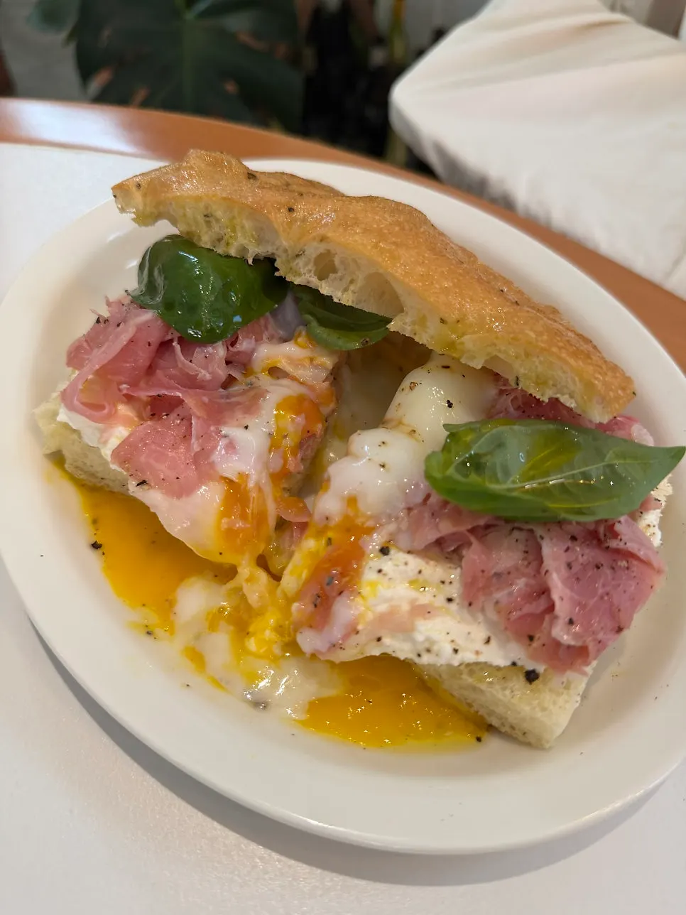 Cross-section of the sandwich with poached egg and jambon