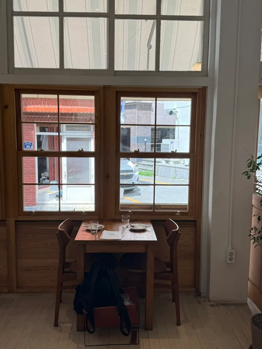 Interior with 4-top and 3-top tables