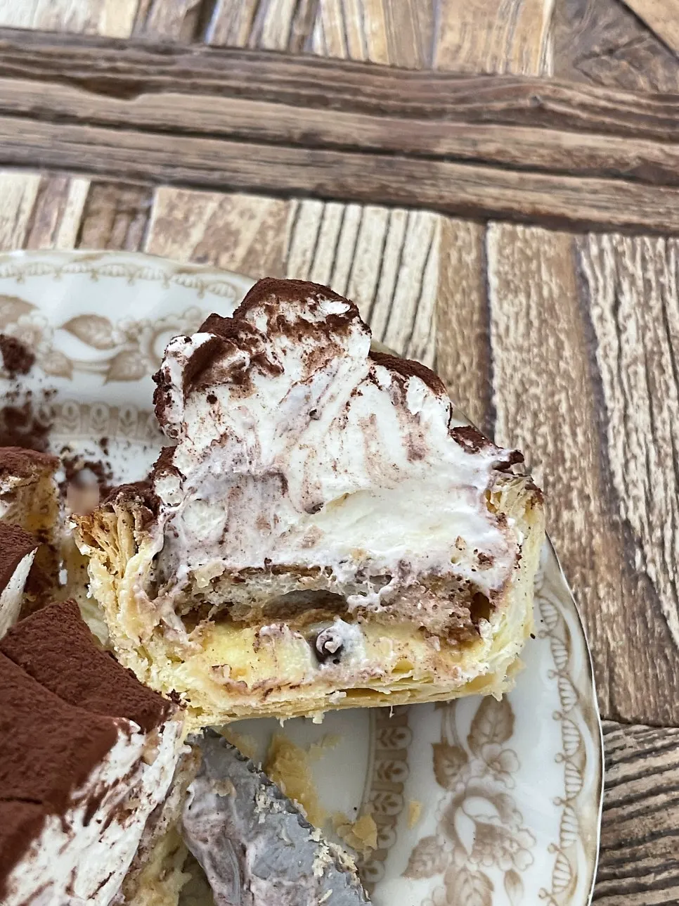 Cross-section of tiramisu cream pie cut with a fork