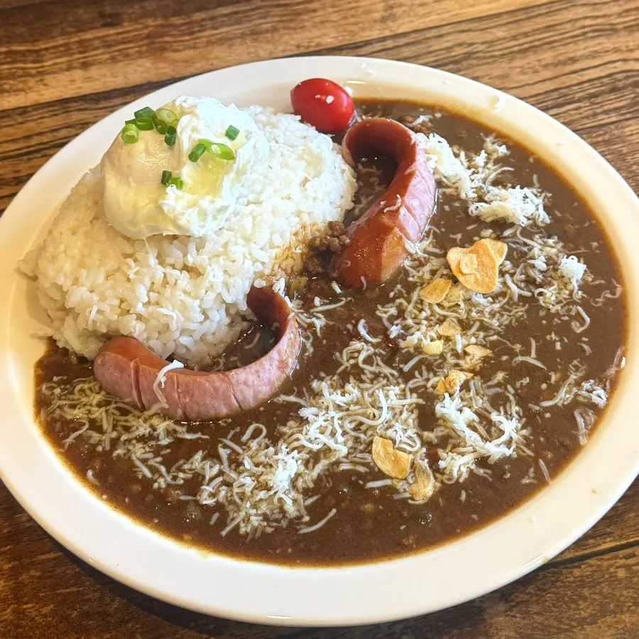 Special curry with poached egg, sausage, and cheese