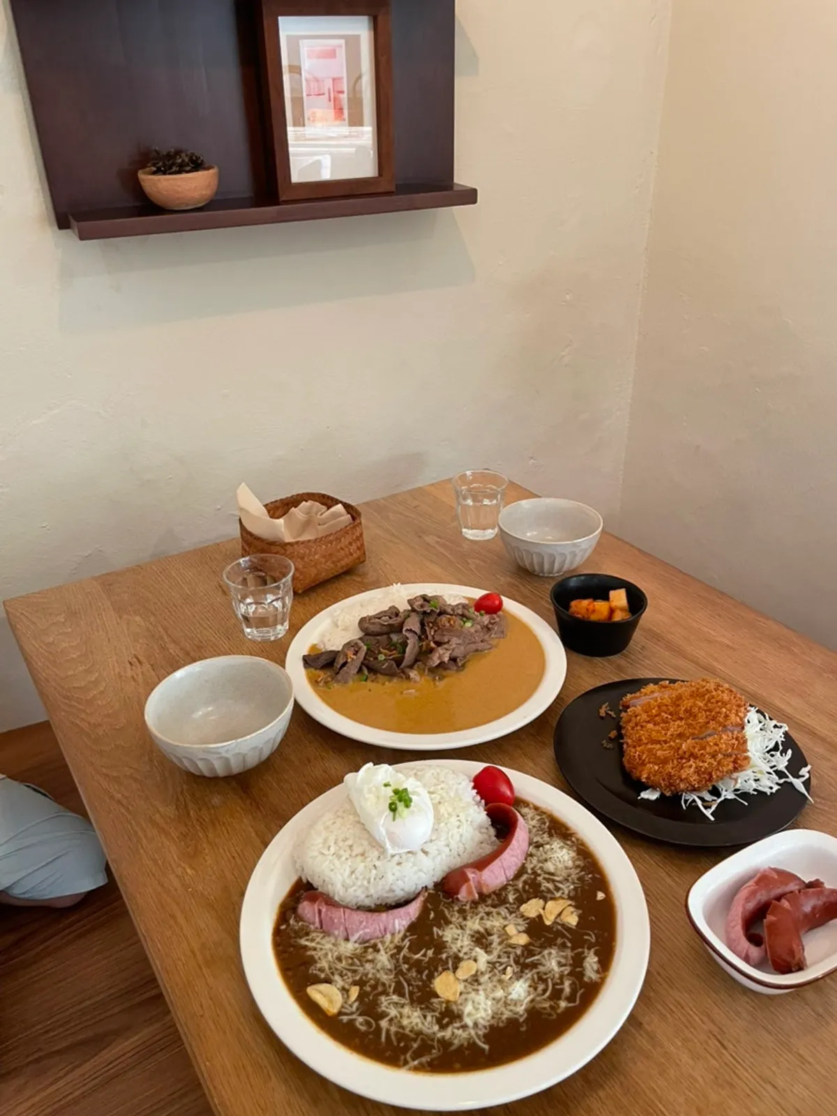Table setting with brisket cream curry and special curry