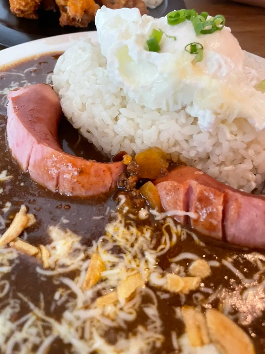 Sarugak20's special curry topped with sausage, cheese and poached egg
