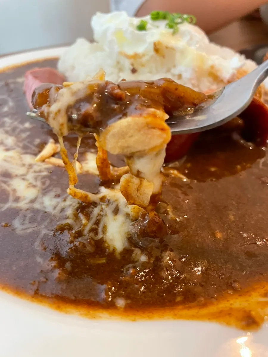 Special curry piled with a big sausage and plenty of cheese
