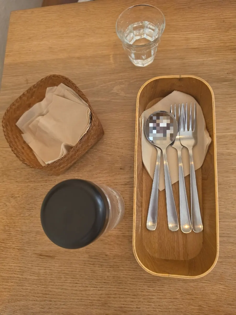 Self-serve bar with still water, lime water, and green tea