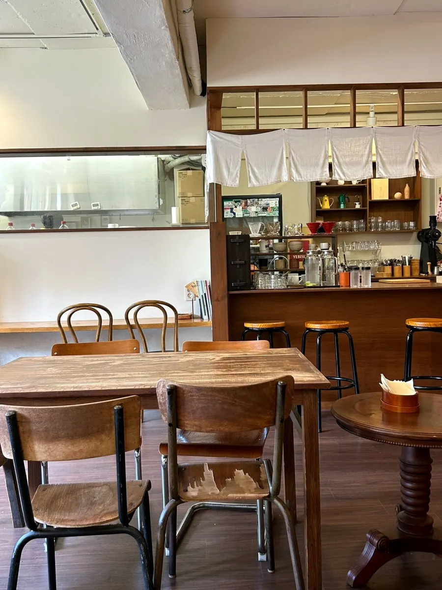 Full view of the shop with bar seats and tables together