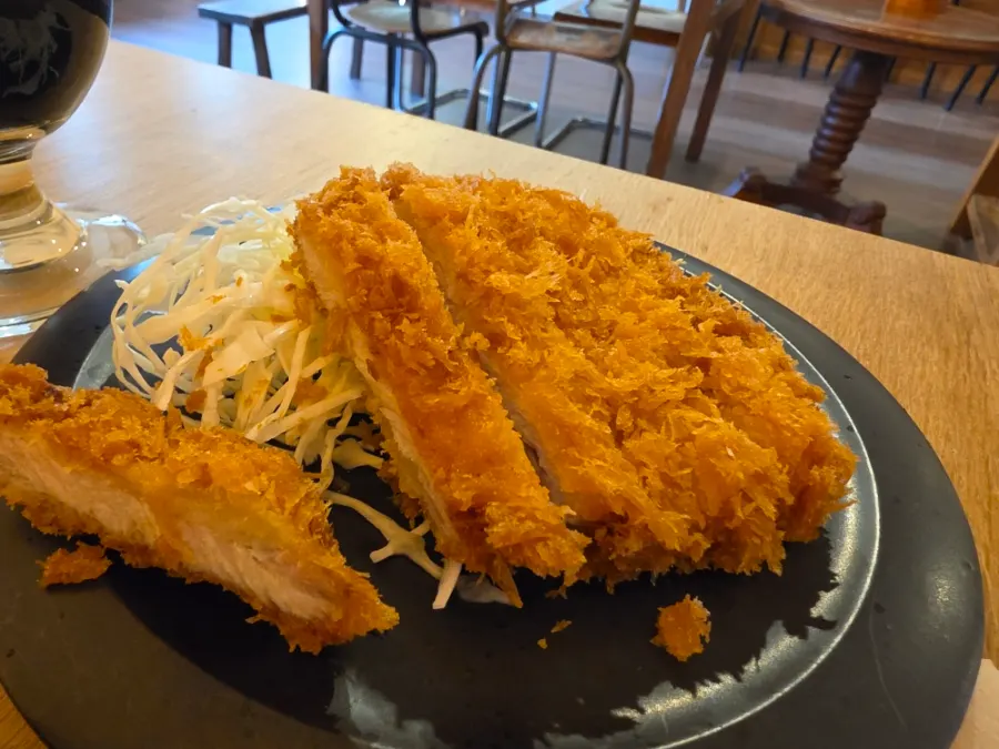 Crispy tonkatsu served alongside the curry