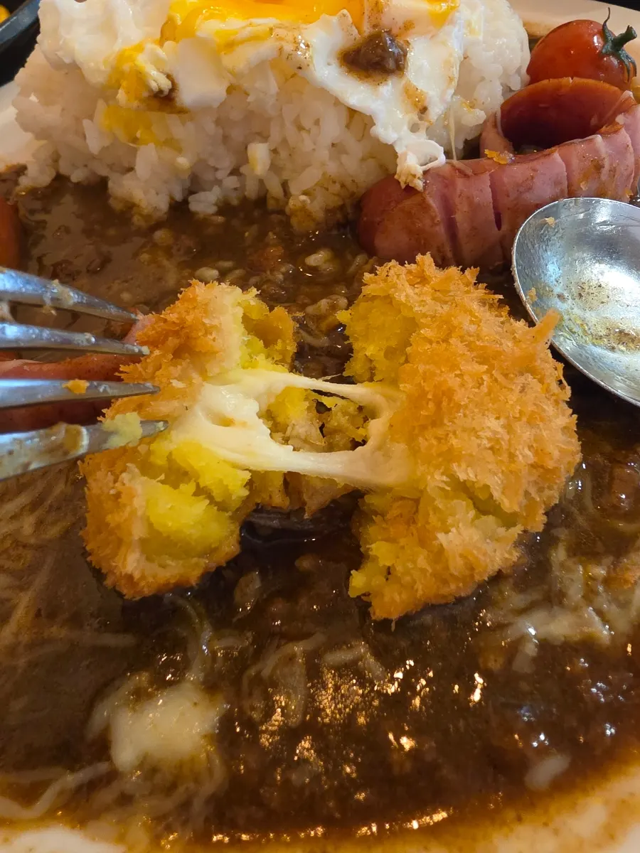 Croquette eaten alongside the curry