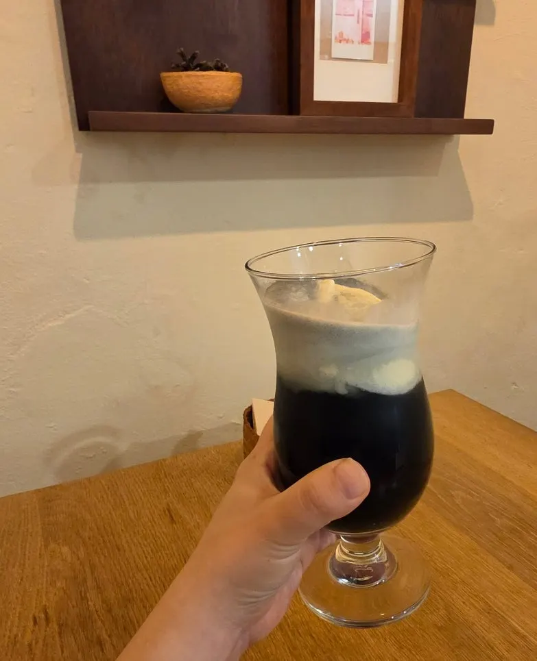 A glass of bright green melon soda