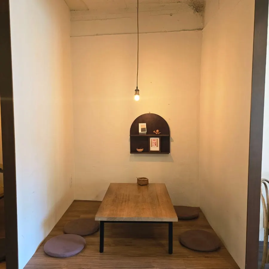 Window bar table with a view of tiled roofs outside