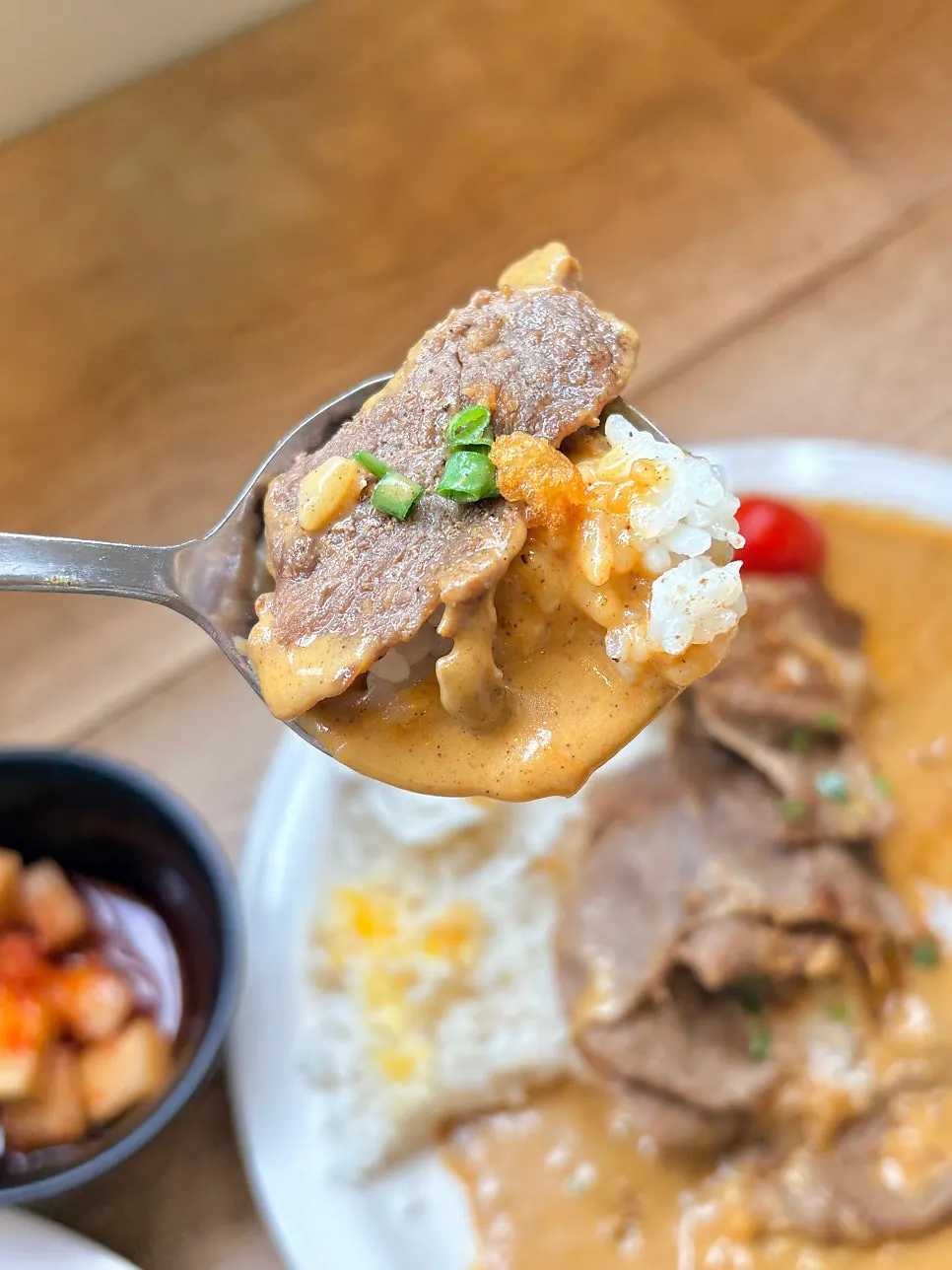 Cream curry topped with brisket and scallions