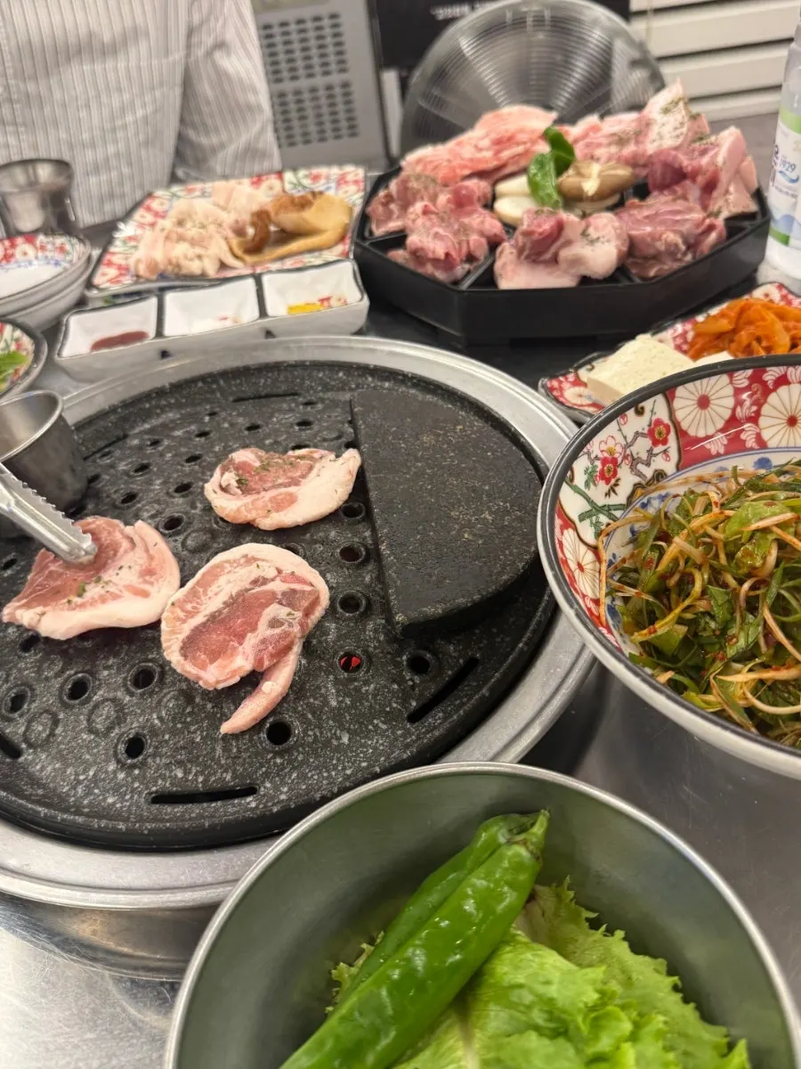 A fully grilled piece of rare pork cut