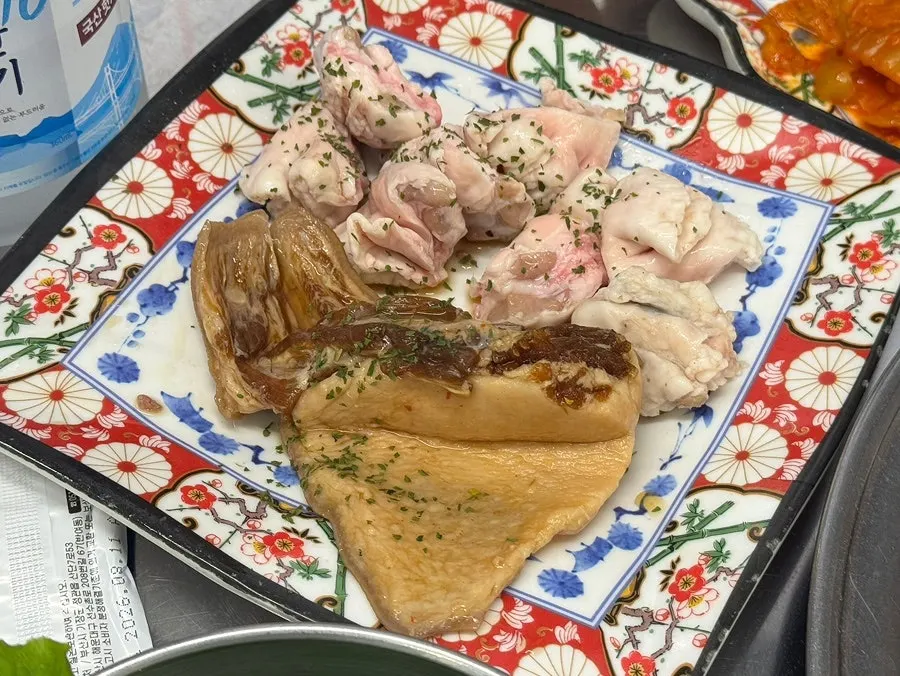 A full table of side dishes at the BBQ restaurant