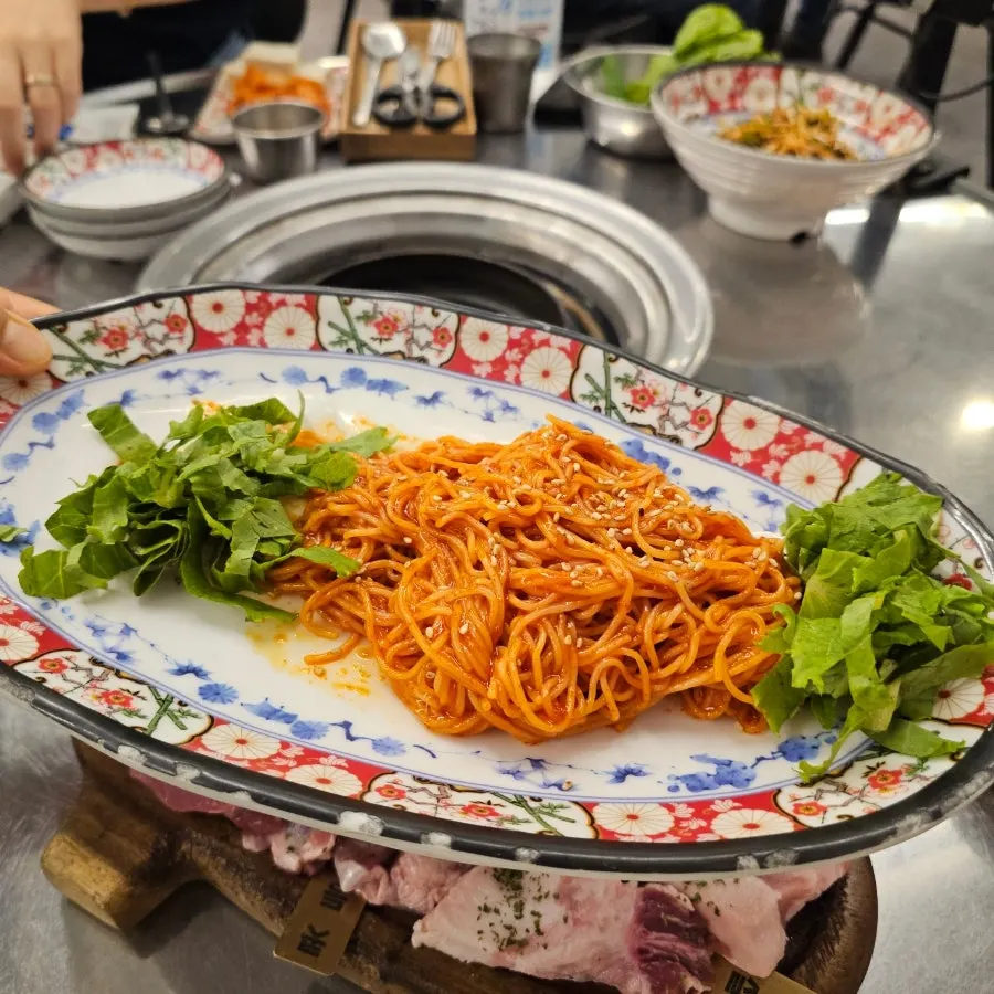 Bibimmyeon, gat kimchi, and pa-muchim served as basic side dishes
