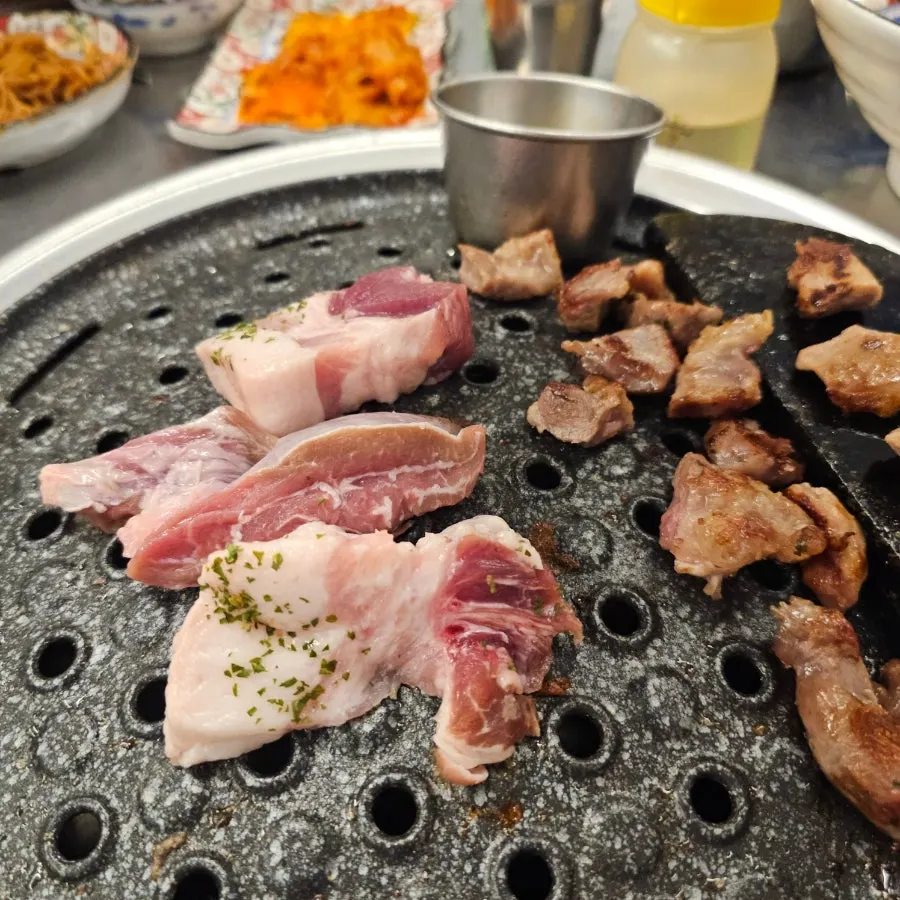 Bibim naengmyeon eaten alongside the grilled meat