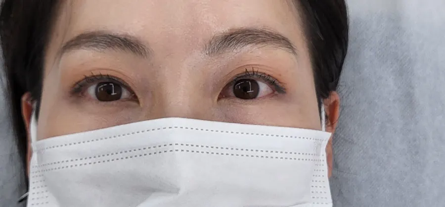 Close-up of mascaraed lashes before treatment