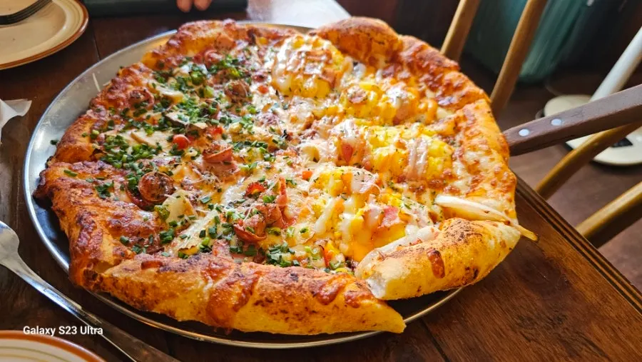 Half-and-half pizza with egg potato and Freewill pizza