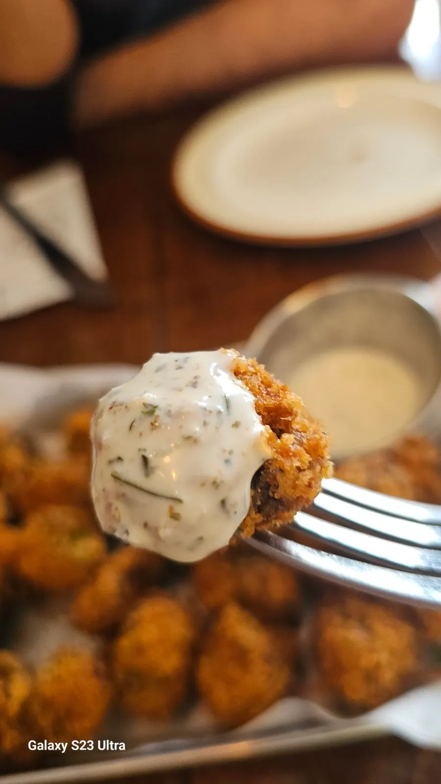 Fried mushroom dipped in sauce