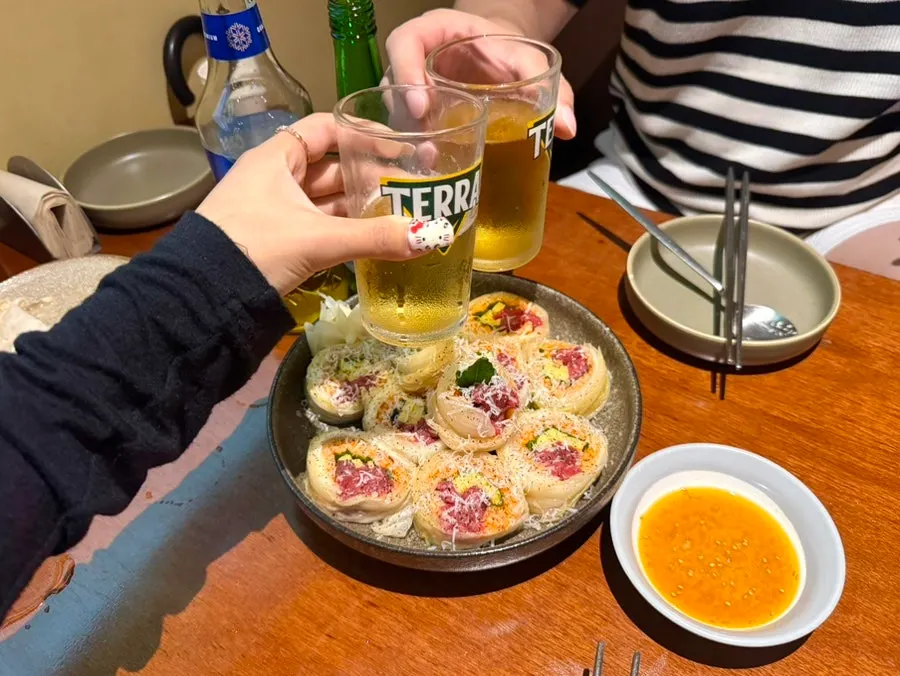 Table with mixed somaek drinks and side dishes