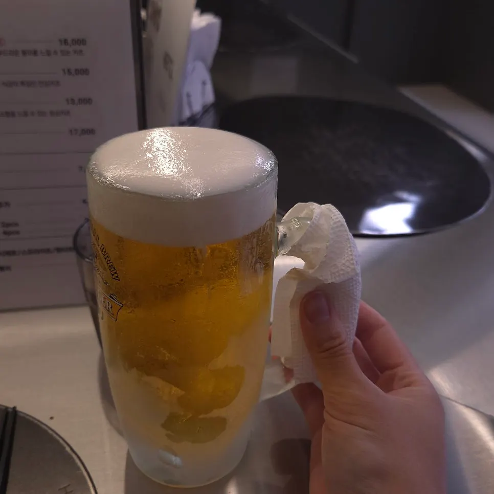 Kirin draft beer served with tissue wrapped around the handle