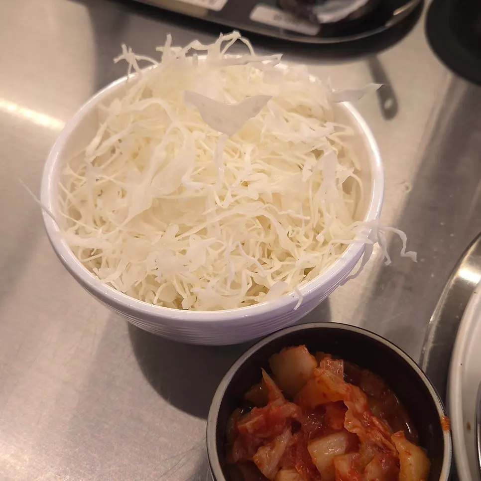 A refilled mountain of cabbage salad
