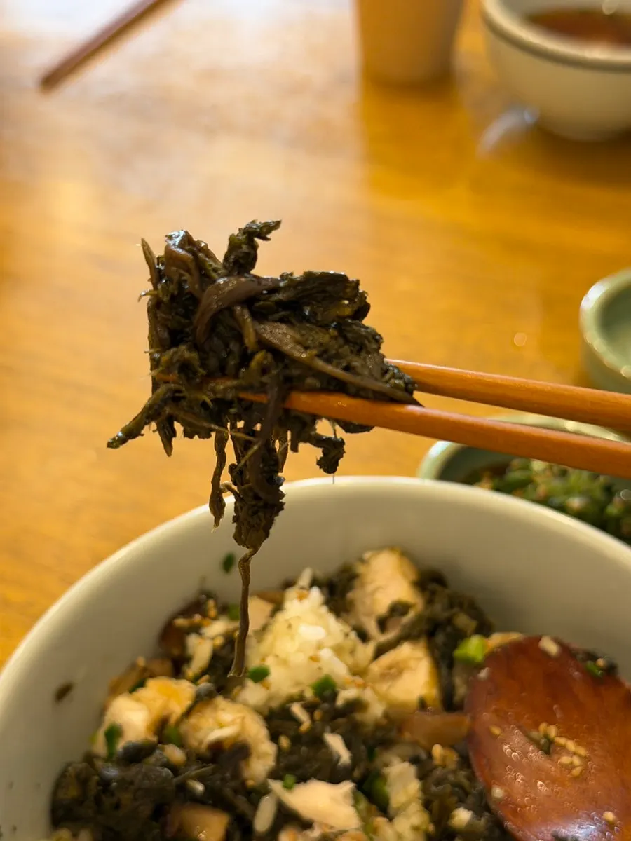 Close-up of rice topped with thistle greens