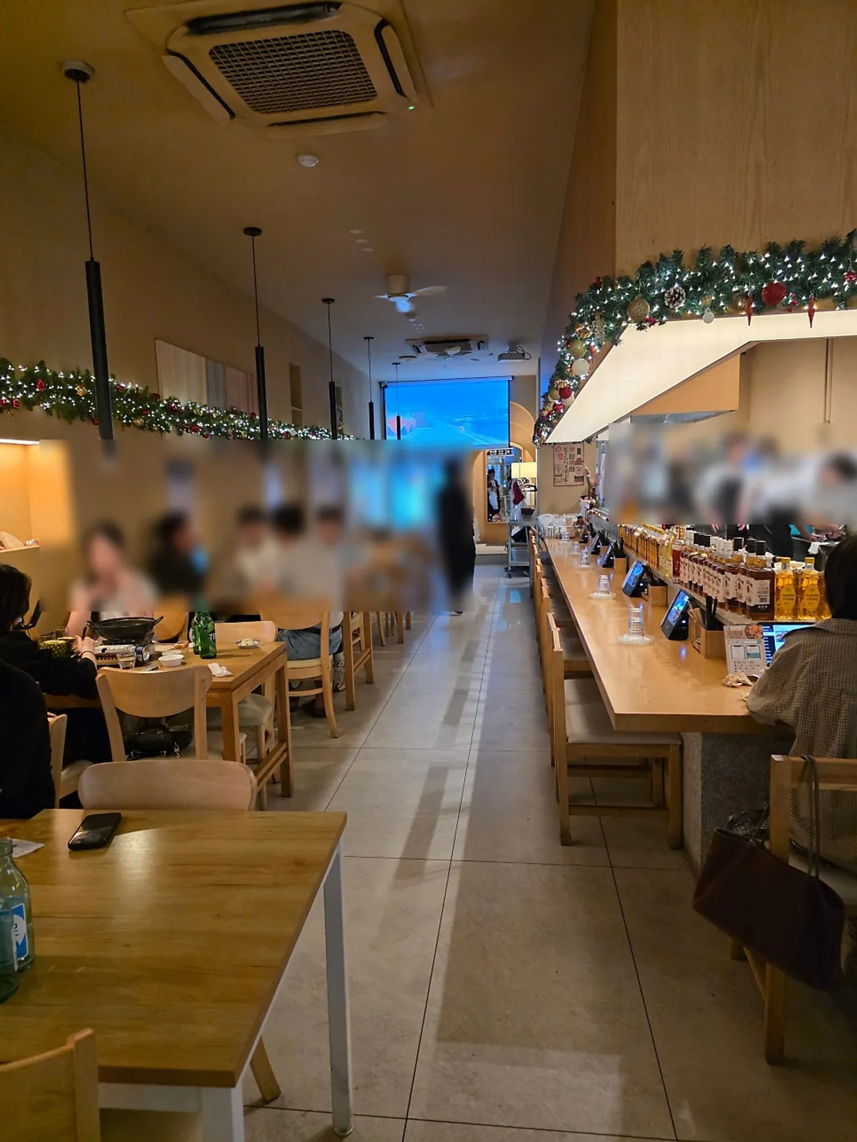 Interior of 12.24 Seomyeon Branch with table and counter seating