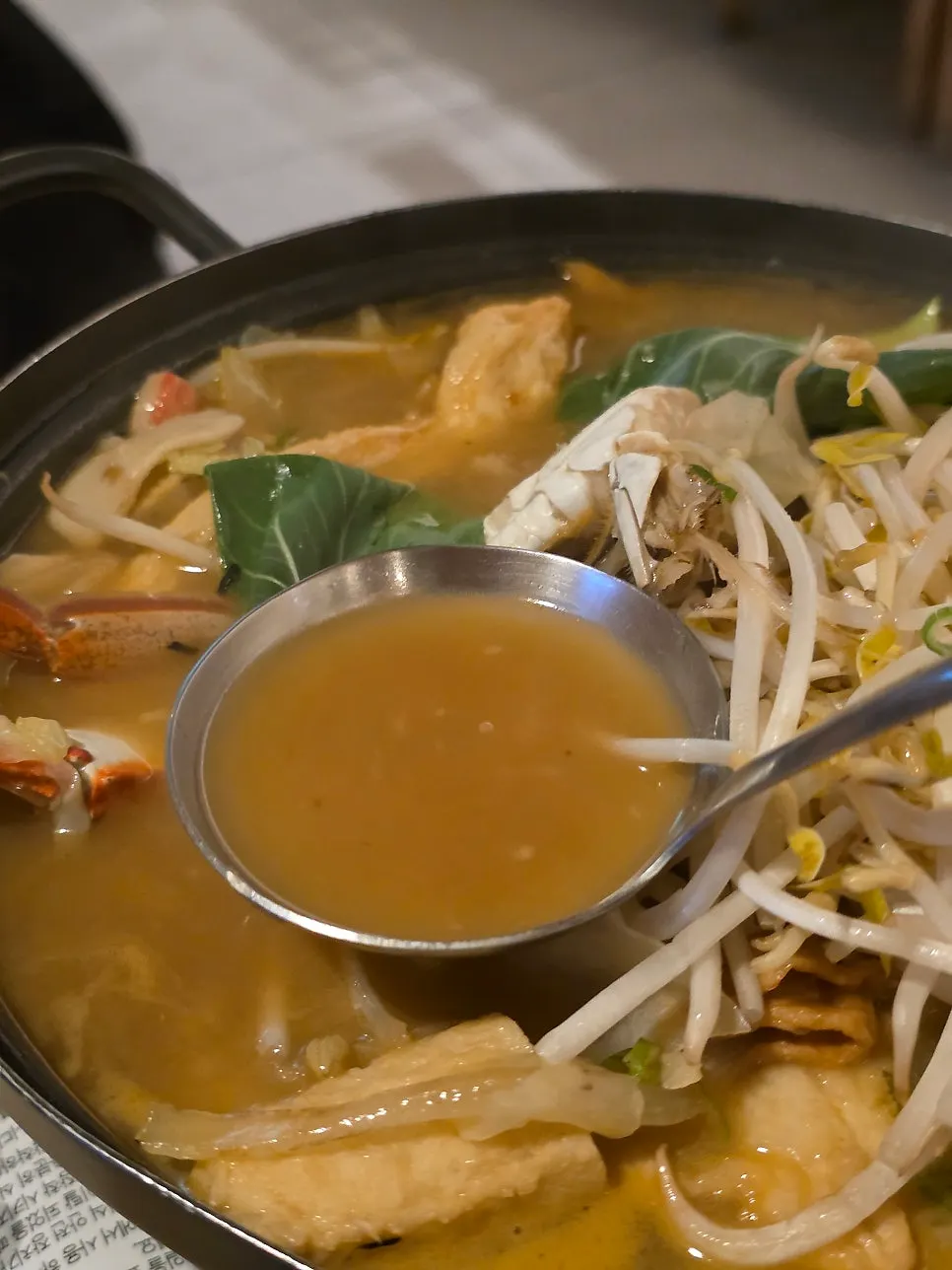 Broth scooped into a small side plate