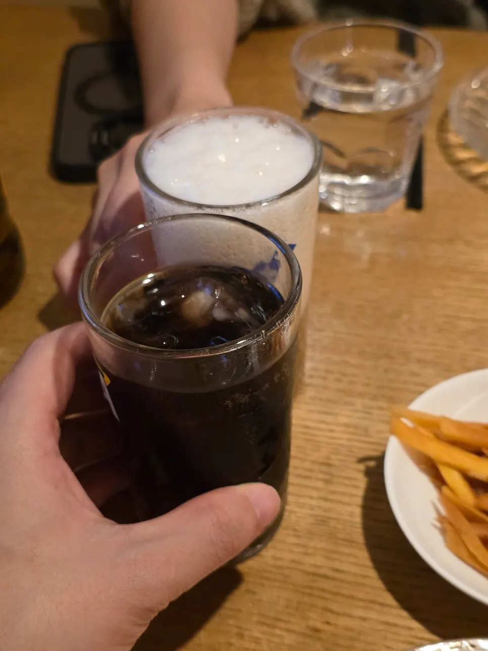 Glass of soju-and-beer next to the crab odeng-tang