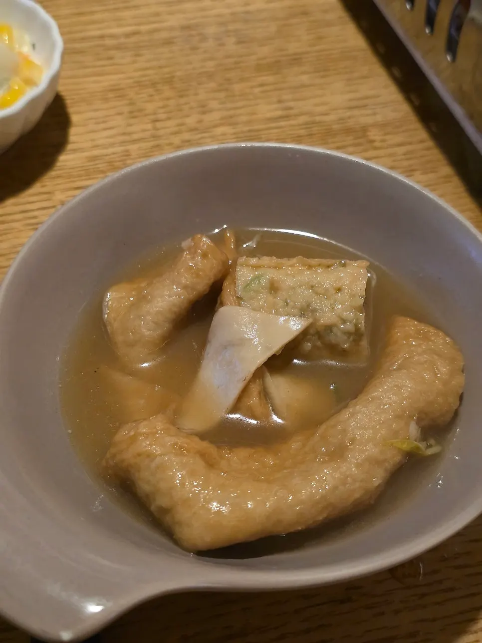 A piece of fish cake being lifted out