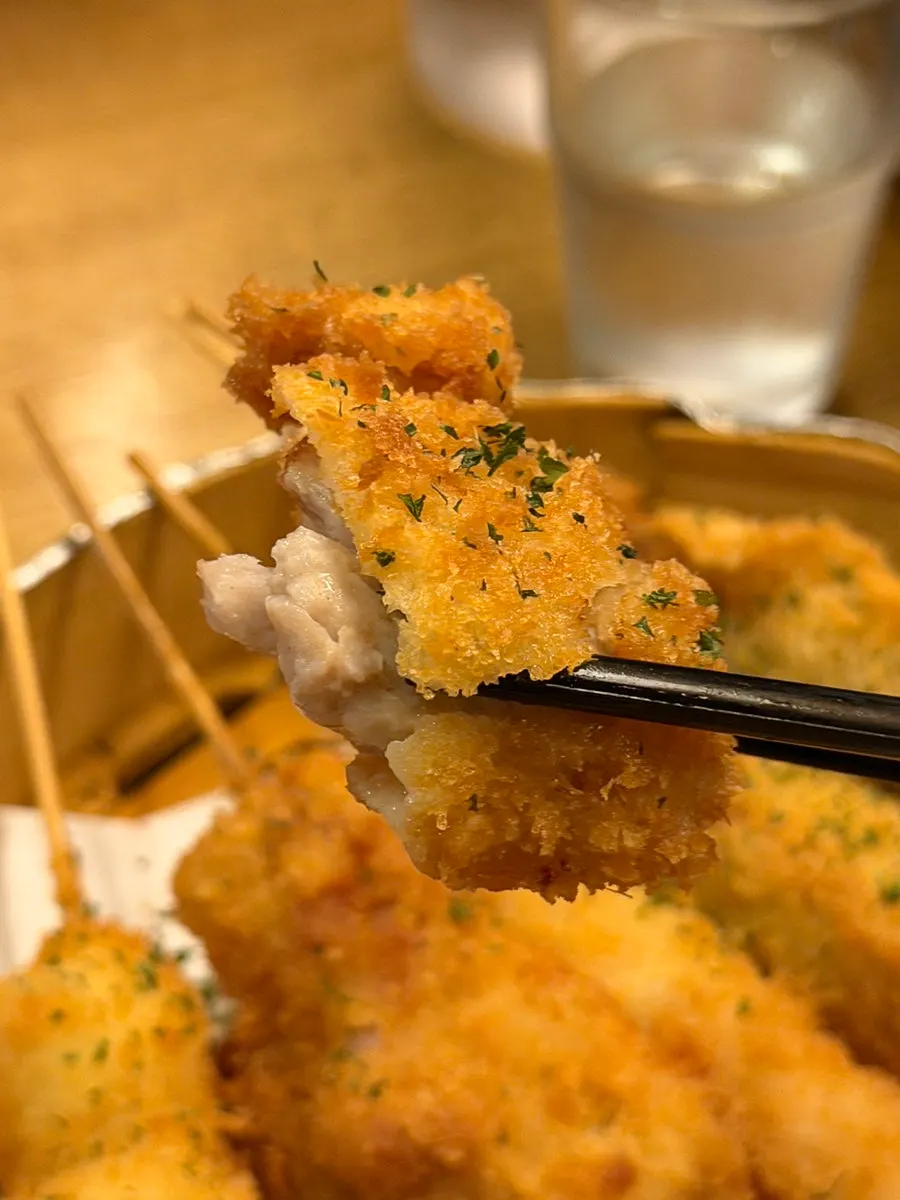 Close-up of chicken thigh and shrimp kushikatsu